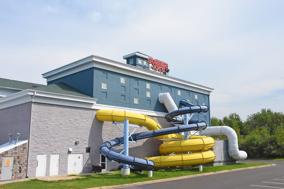 Surfari Joe's indoor water park building with yellow and blue tube slides